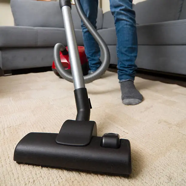 Professional Janitor cleaning carpet